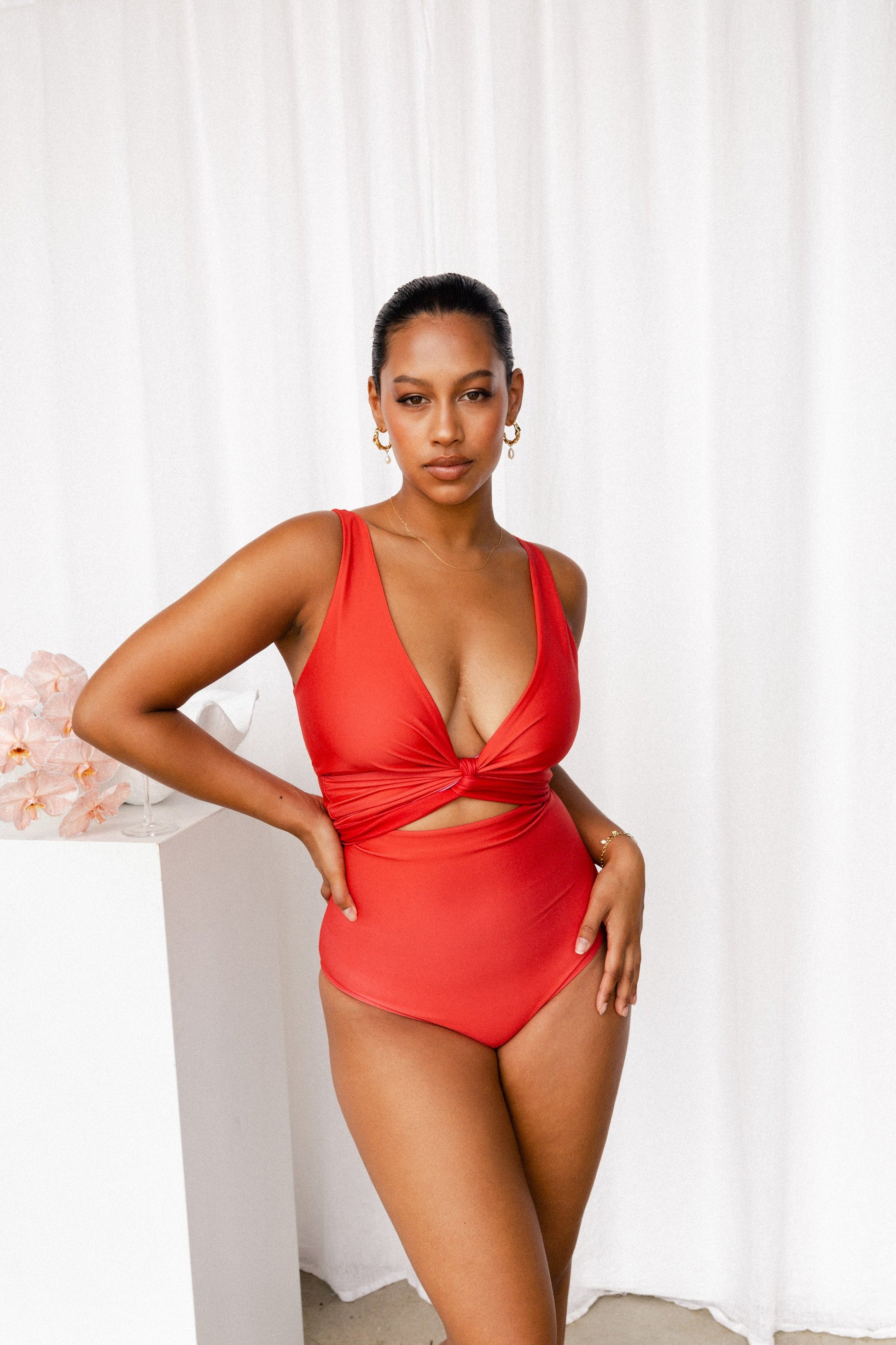 Woman wearing red bikini with tie at front